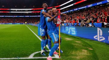 Aurélien Tchouaméni merayakan gol penyeimbang Real Madrid setelah Benfica unggul lewat Rafa Silva di Liga Champions.