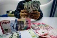 Ilustrasi pergerakan nilai tukar dolar Amerika Serikat terhadap rupiah di pasar keuangan.