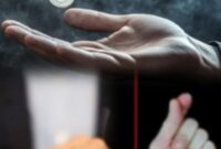 Ilustrasi pesulap menampilkan trik sulap koin di depan penonton dengan teknik tangan cepat.