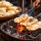 Kerupuk bakar khas Palembang yang dipanggang di atas bara api oleh pedagang tradisional.