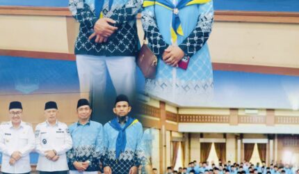 Pasangan suami istri Zaini Febriani dan Santi saat pelepasan jamaah haji Kota Sungai Penuh tahun 2026